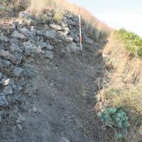 Fig 11. Murgie upper city wall. Because of the external wall located in the valley, there is the nucleus of the wall with small stone size and back fill. Besides acting as defense equipment, it functions also as a containment wall. (Image by Author)