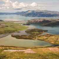 Fig. 7. View of the Vivari Lake with the acropolis of Bouthrotum in the middle and the peninsula of Ksamilli and the Corfu Island in the background  (Giorgi, Bogdani 2012. Courtesy of P. Giorgi).