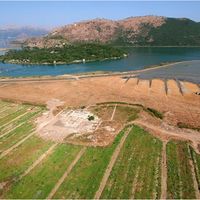 Fig. 1. Aerial shot of the excavations looking west across Butrint towards the Straits of Corfu (photo: Alket Islami)